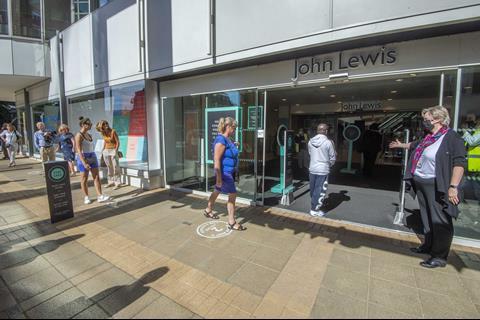 Customers queued to get into John Lewis in Kingston, one of two department stores the retailer reopened today.